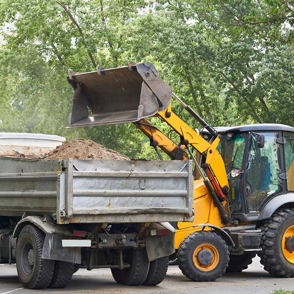 the application of a mechanical load or force to something. Road work