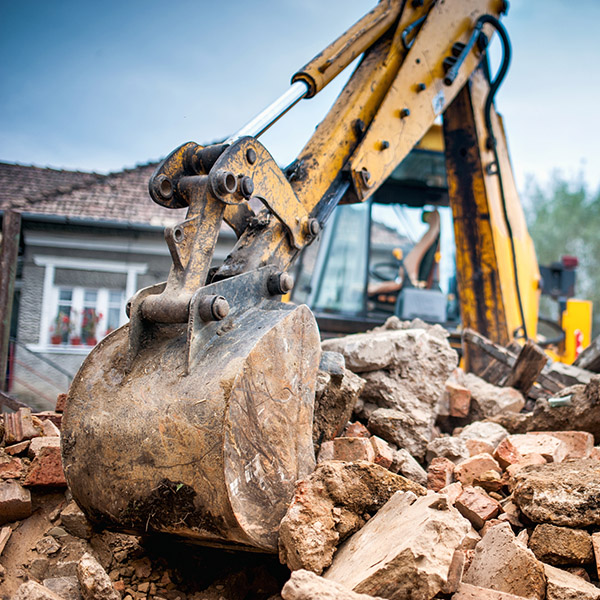 Hydraulic crusher excavator backoe machinery working on site demolition
